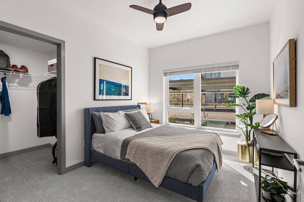 a bedroom with a bed and a ceiling fan a bedroom with a bed and a ceiling fan at Gage On Sixth, Tacoma, WA 98406