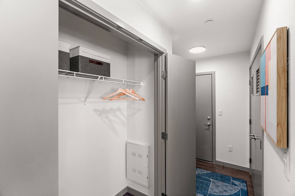 a walk in closet with a refrigerator and a washing machine at Gage On Sixth, Tacoma, 98406