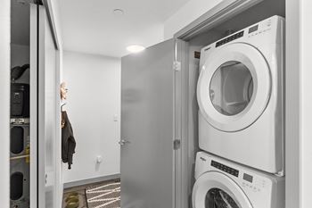 a small laundry room with a washing machine and a dryer at Gage On Sixth, Tacoma