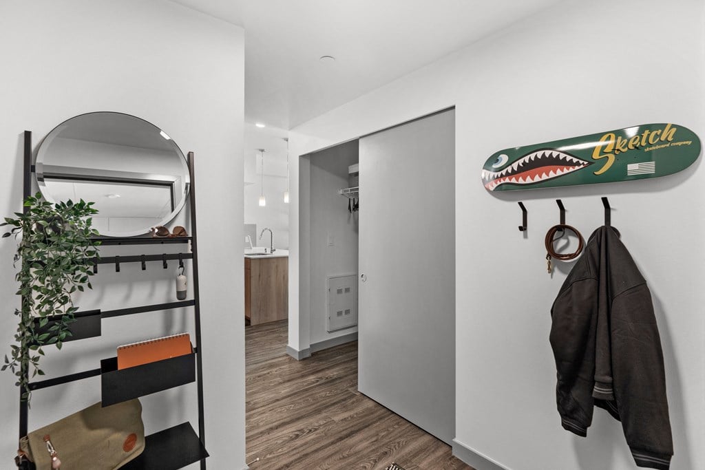 a room with a closet and a surfboard on the wall at Gage On Sixth, Tacoma