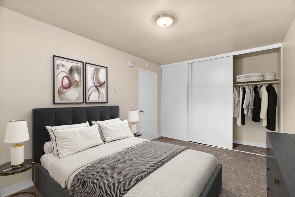 A bedroom with a large bed and a wardrobe.