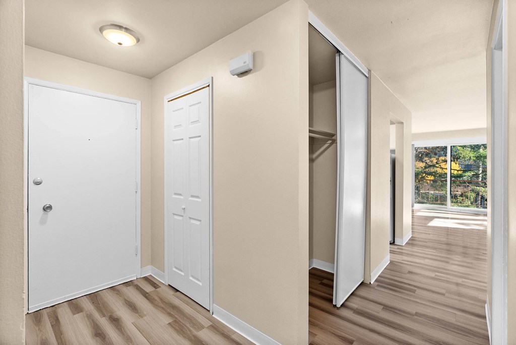 A white door is on the left and a white closet door is on the right.