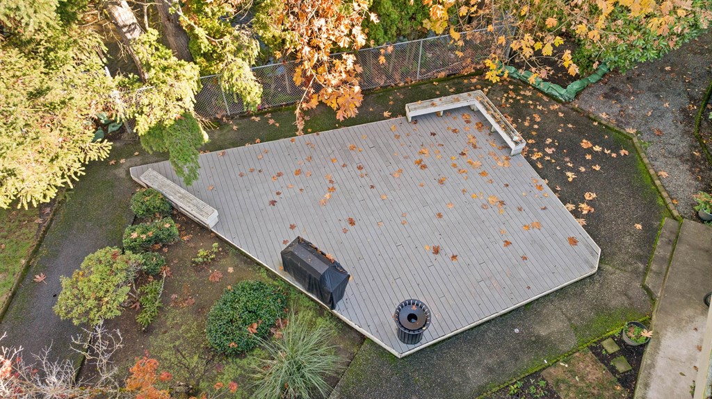 A roof with a grey shingle and a black box on it.