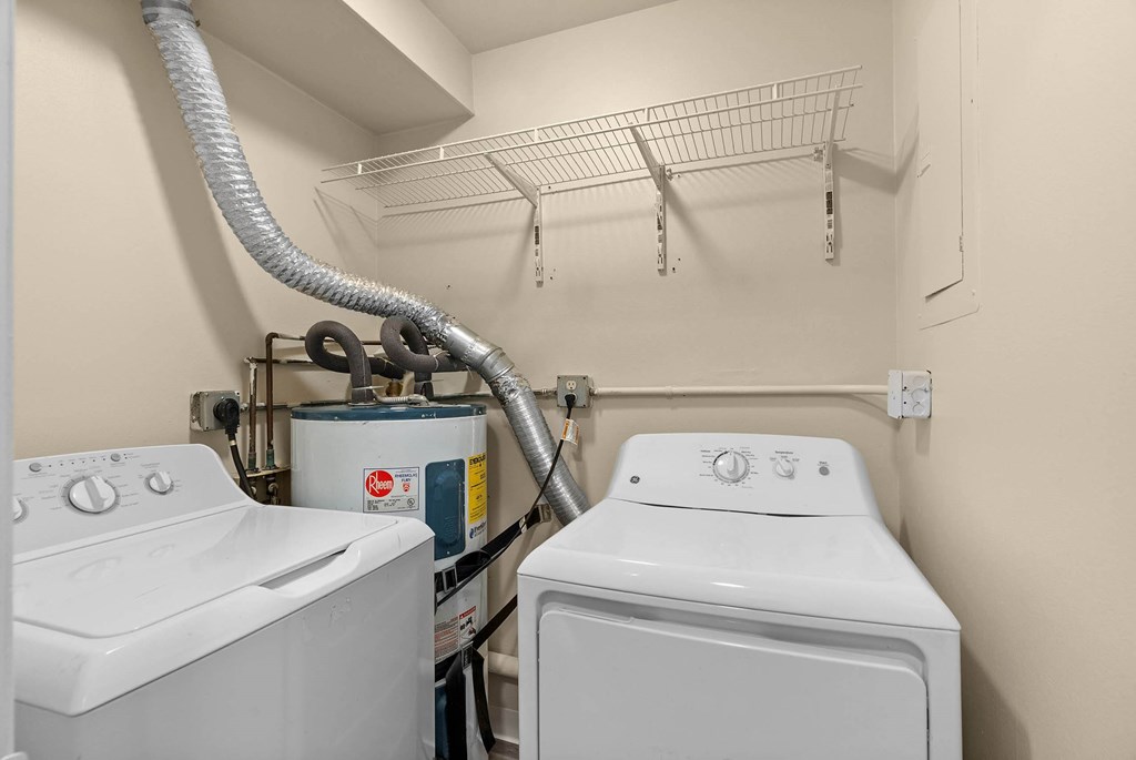 A laundry room with a washer and dryer.