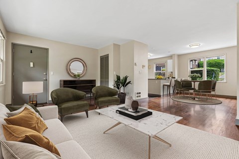 A living room with a white couch and a coffee table.