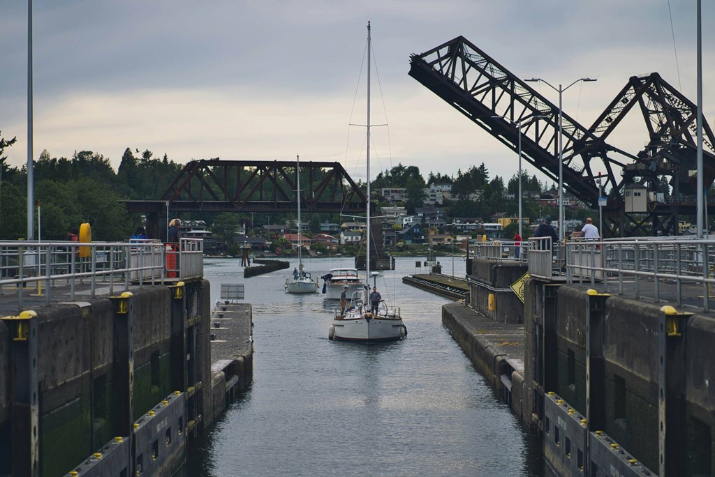 A boat is passing through a drawbridge.