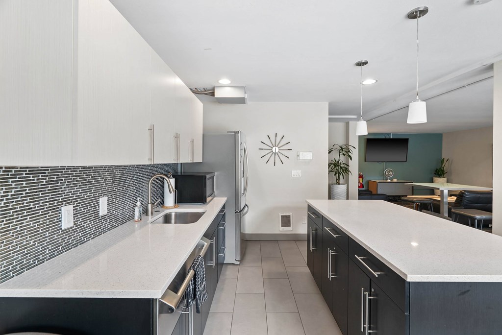 A modern kitchen with a black and white color scheme.
