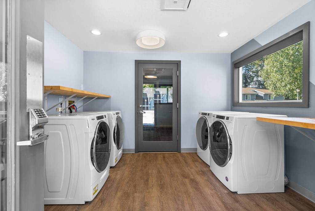 A laundry room with a washer and dryer in it.
