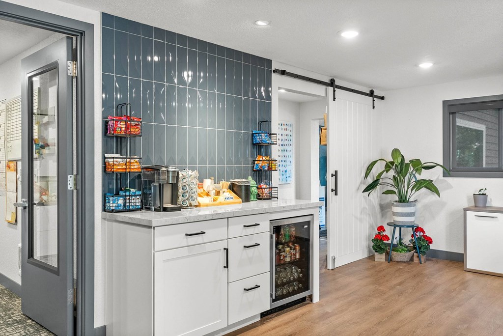 A kitchen with a white fridge and a white oven.