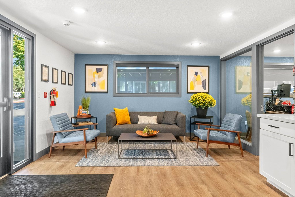 A living room with a grey couch and a coffee table.