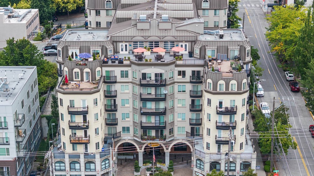 A large, multi-story building with a balcony on the second floor.