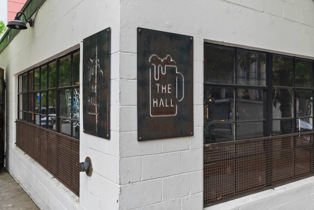 A white building with a sign that says