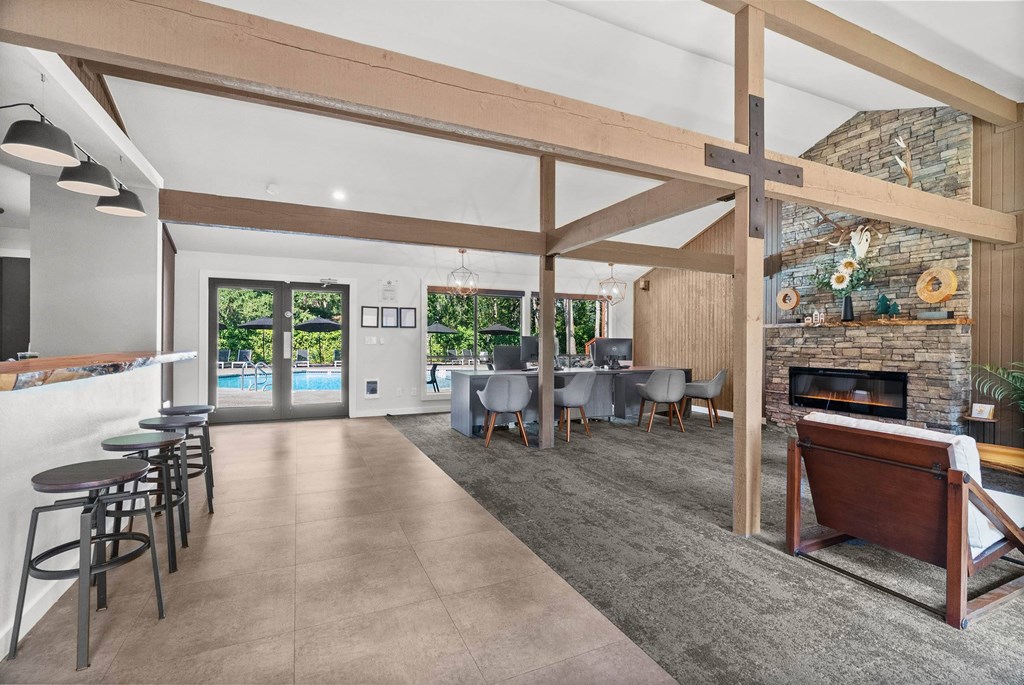 A modern living room with a fireplace and a dining area.