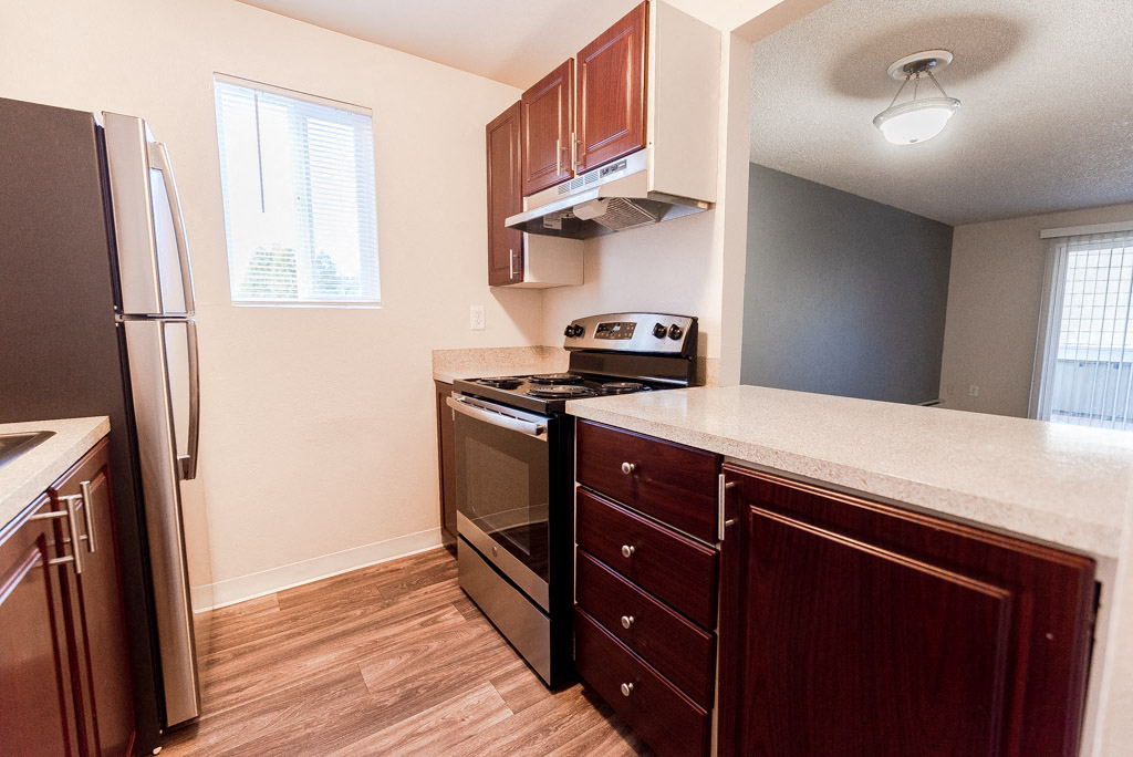 Lakewood Apartments - Bellmary Park Apartments - Kitchen, Living Room, and Deck