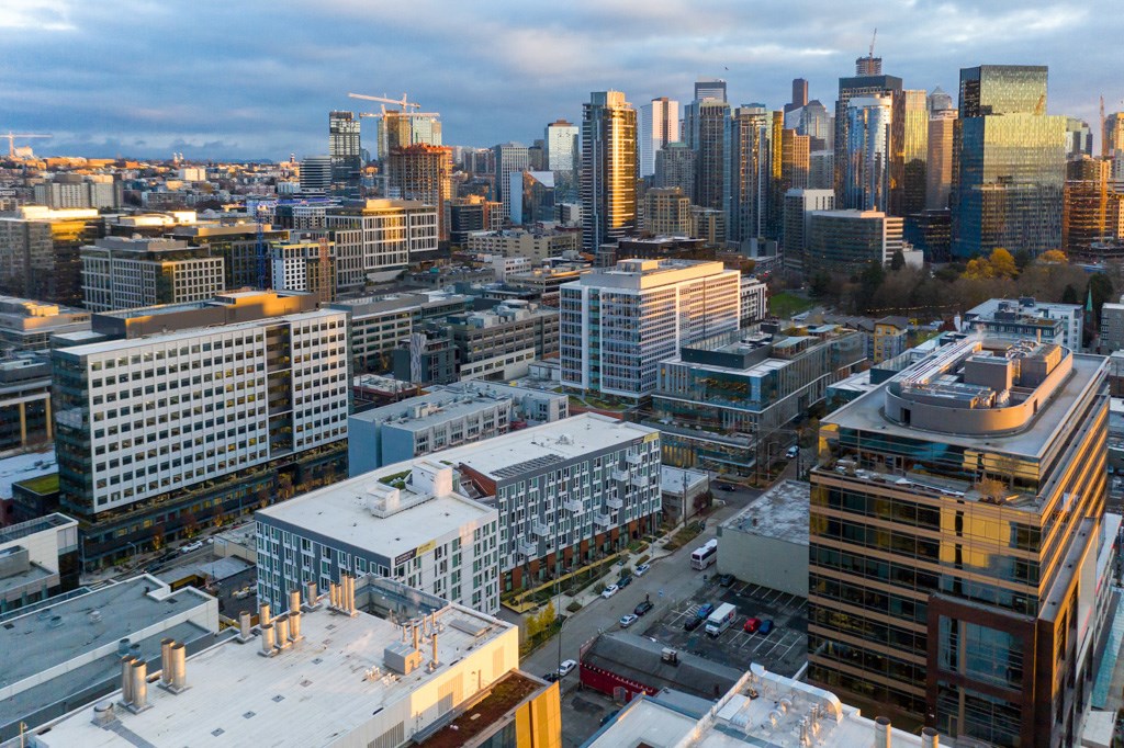 A cityscape with buildings of various heights and architectural styles.