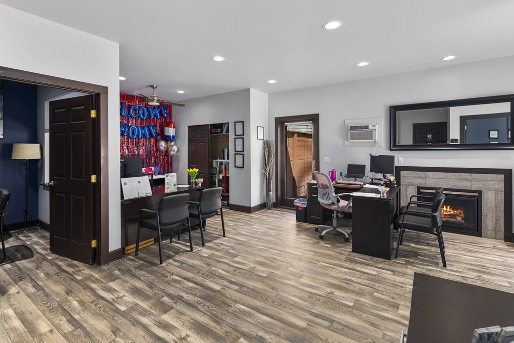 A modern living room with a fireplace and a dining area.