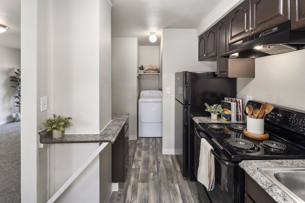 A black stove top oven with a pot on it.