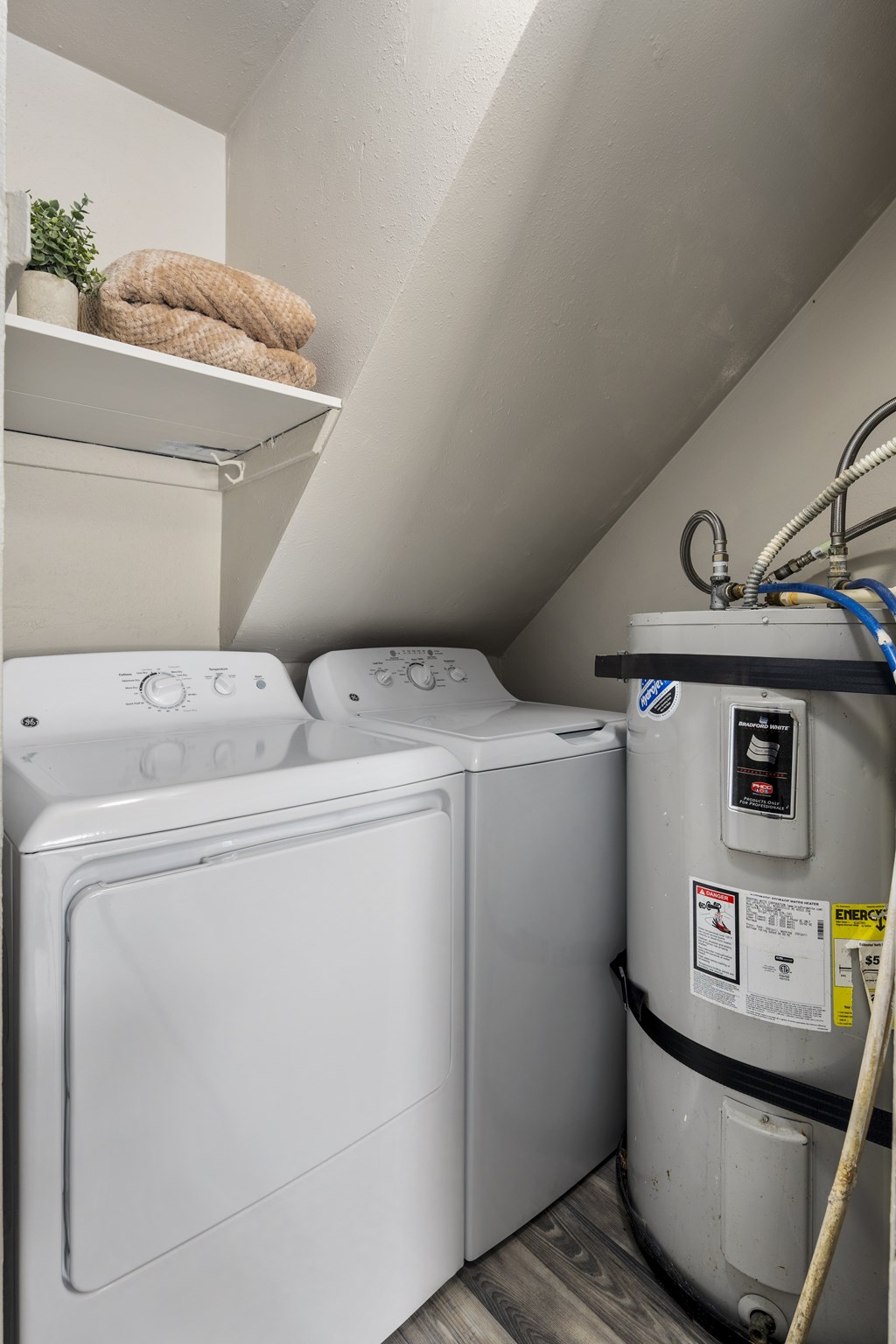 A washing machine and dryer in a small laundry room.
