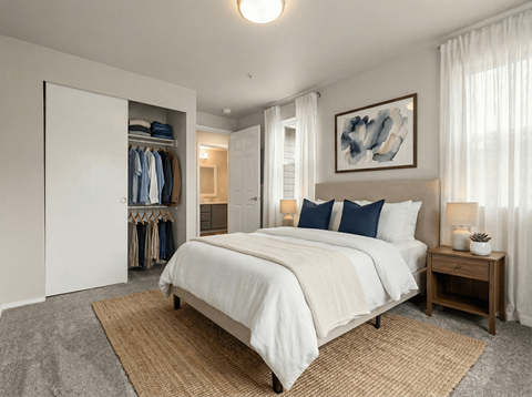 A bedroom with a large bed and a wardrobe.