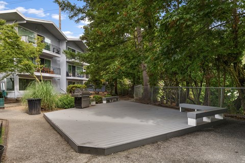A playground area with a slide and a bench.