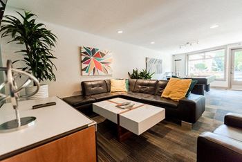 a living room with a couch and a table at Cadence, Seattle, WA, 98107