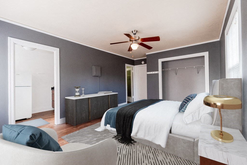 a bedroom with a bed and a ceiling fan at Edwards on Fifth, Seattle, WA, 98121