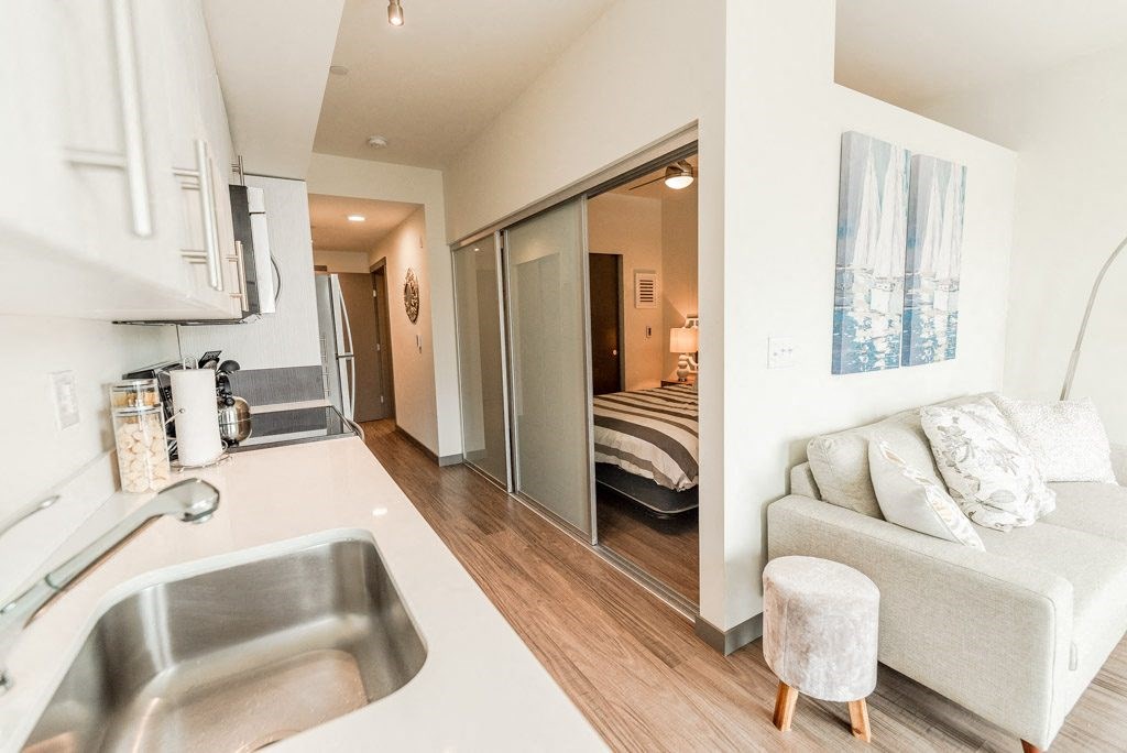 Apartments in Seattle, WA - Icon Apartments Modern Bedroom Next to Kitchen
