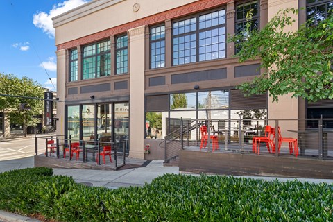 A building with a red awning and a glass door.