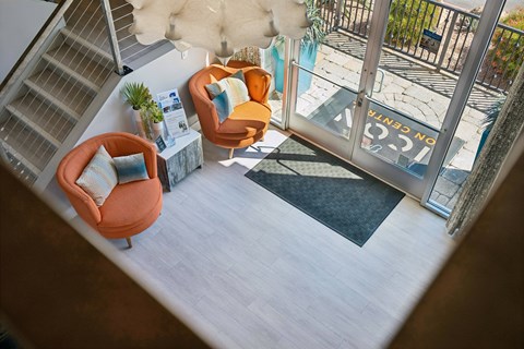 A living room with a couch and a chair.