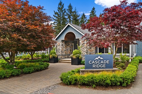 Cascade Ridge sign in front of a building with trees.