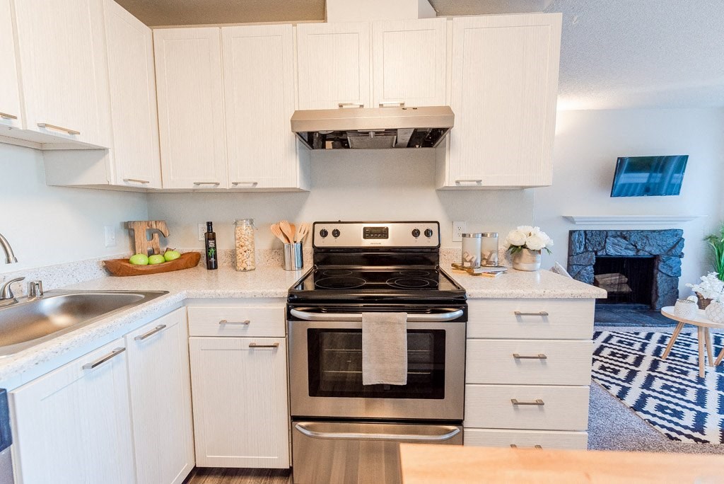 Kitchen with appliances at ReVive Apartments, Fife, Washington