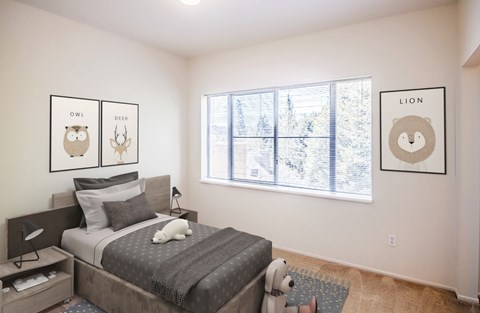 A bedroom with a bed, a window, and two framed pictures on the wall.
