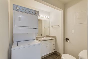 A white oven and sink in a small bathroom. at The Retreat, Sumner, 98390