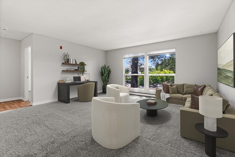 A living room with a grey carpet and a white sofa.