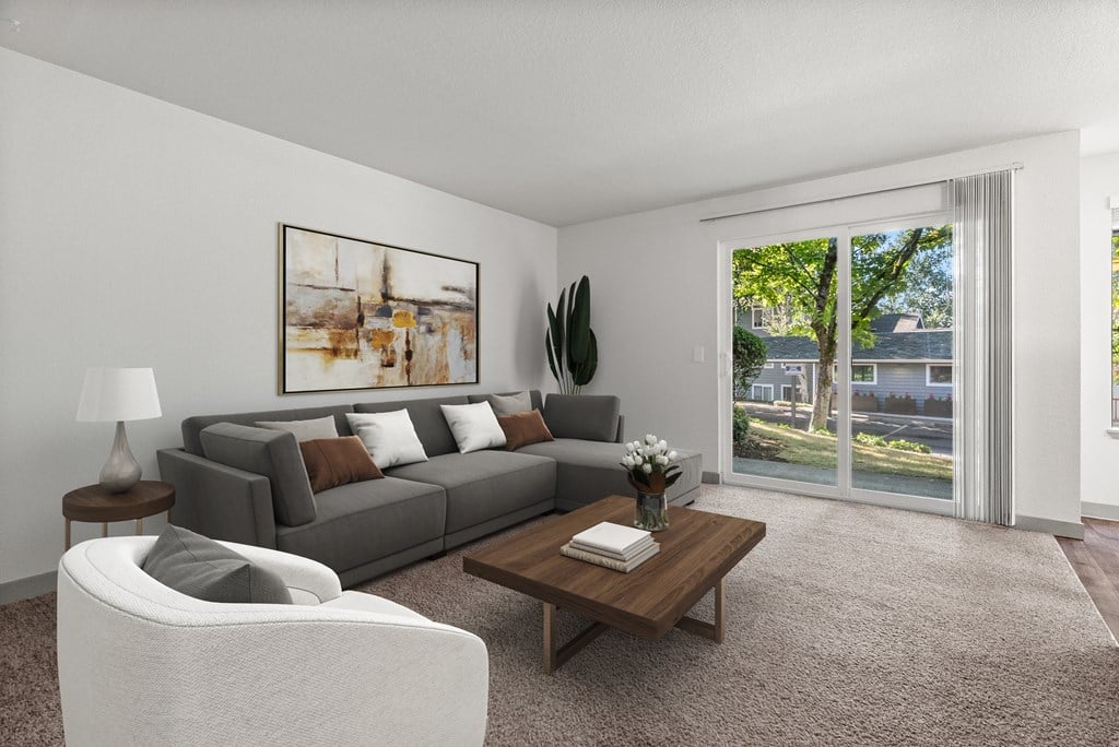 A living room with a grey couch, a white chair, a coffee table, and a painting on the wall.