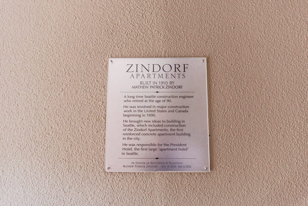 A plaque on a wall that says Zindorf Apartments. at Zindorf, Seattle, WA, 98104