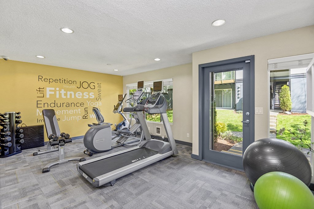 the gym at the enclave at woodbridge apartments in sugar land, tx