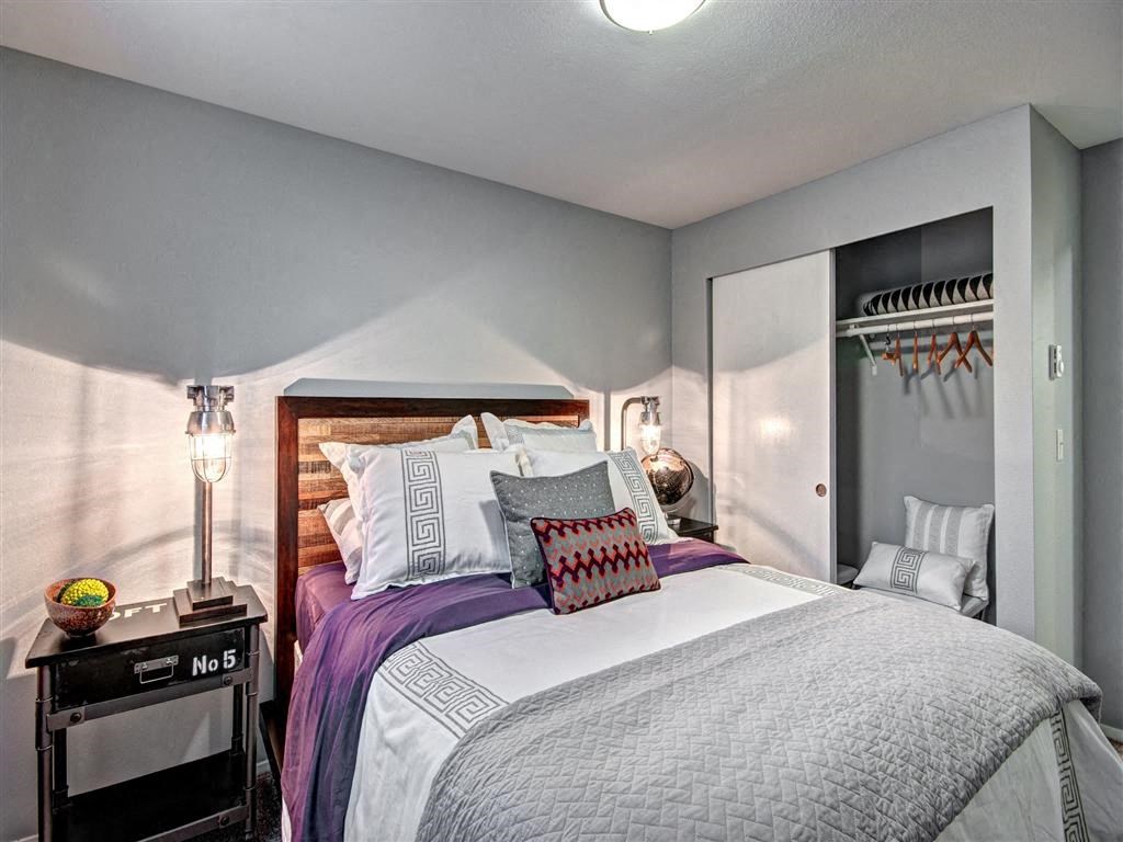 Bedroom with bed and lamp and ceiling light at Deer Creek Apartments, Washington, 98373
