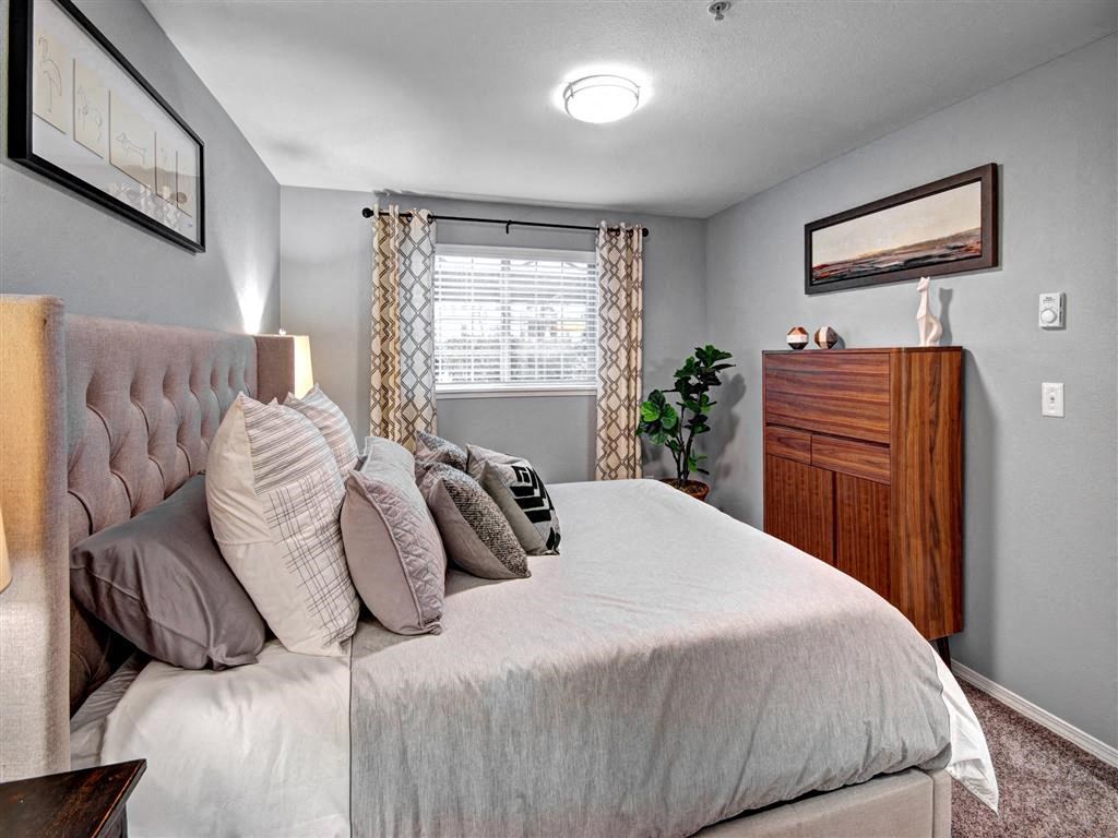 Puyallup Apartments- Deer Creek Apartments- bedroom with cozy bed at Deer Creek Apartments, Washington