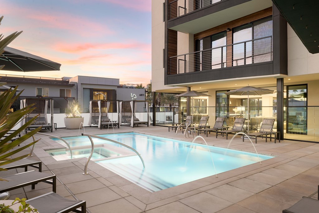 A modern house with a pool in the backyard.