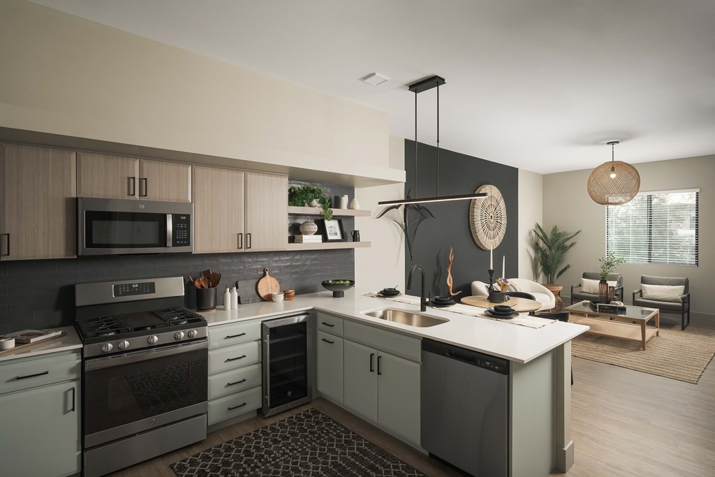 A modern kitchen with a large island and a dining area.