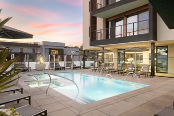 A modern house with a pool in the backyard.