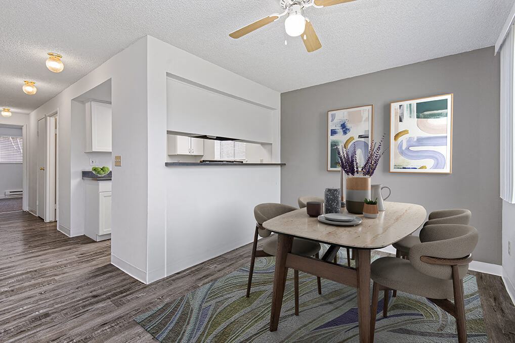 a dining room with a table and chairs