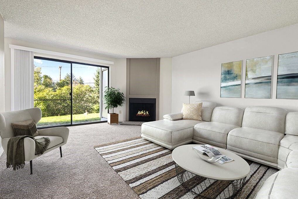 a living room with white furniture and a fireplace