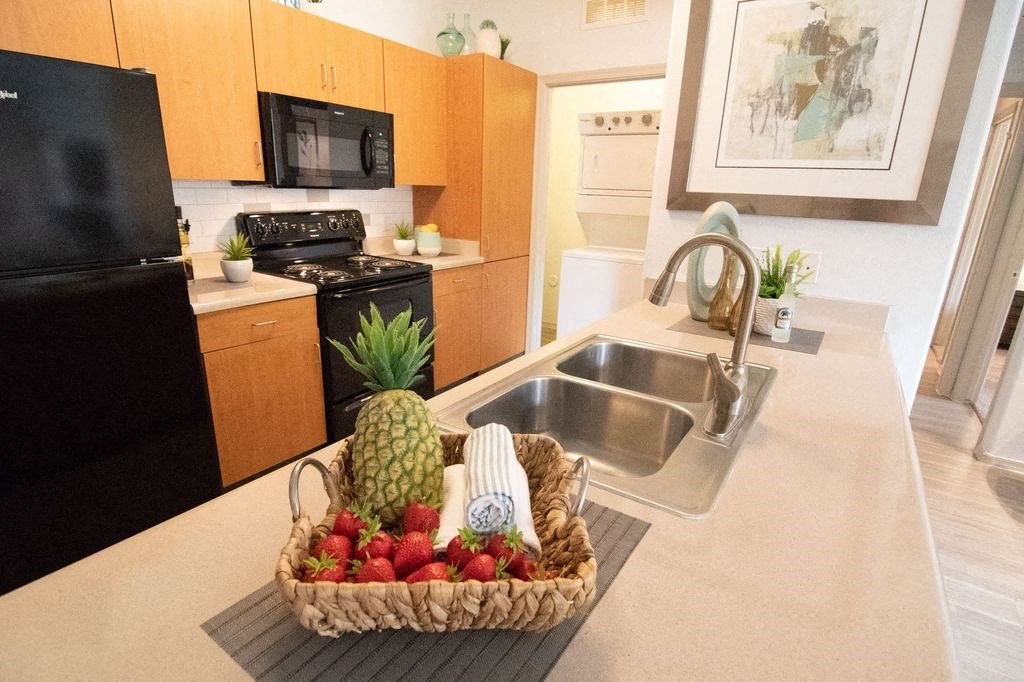 West Valley Phoenix Apartments for Rent - West Town Court Apartments - Kitchen with Quartz Counter Tops and Black Electric Appliances