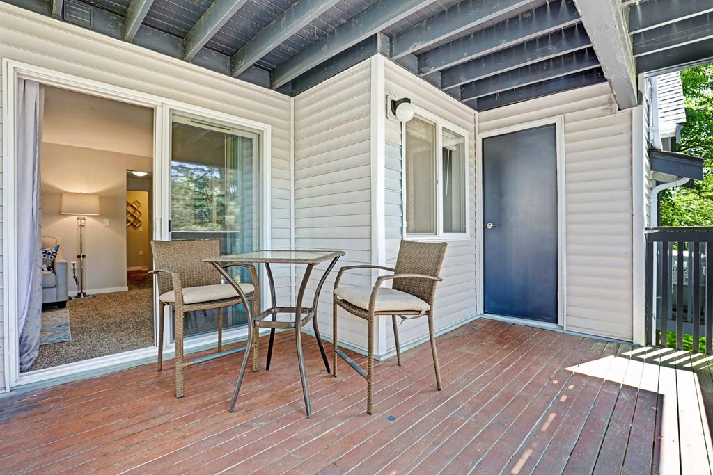 A patio with a table and chairs is shown.