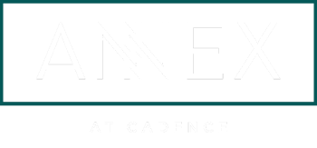 A green sign with the word ANNEX at the top and AT CADENCE at the bottom.