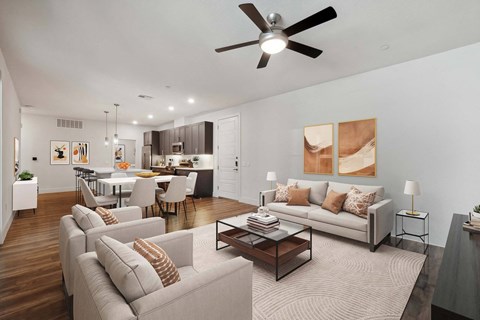A modern living room with a grey sofa set and a wooden coffee table.