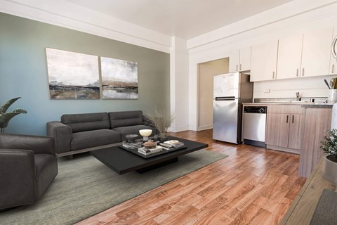 A modern living room with a grey sofa and a coffee table at Addison on Fourth Apartments, Seattle, 98104