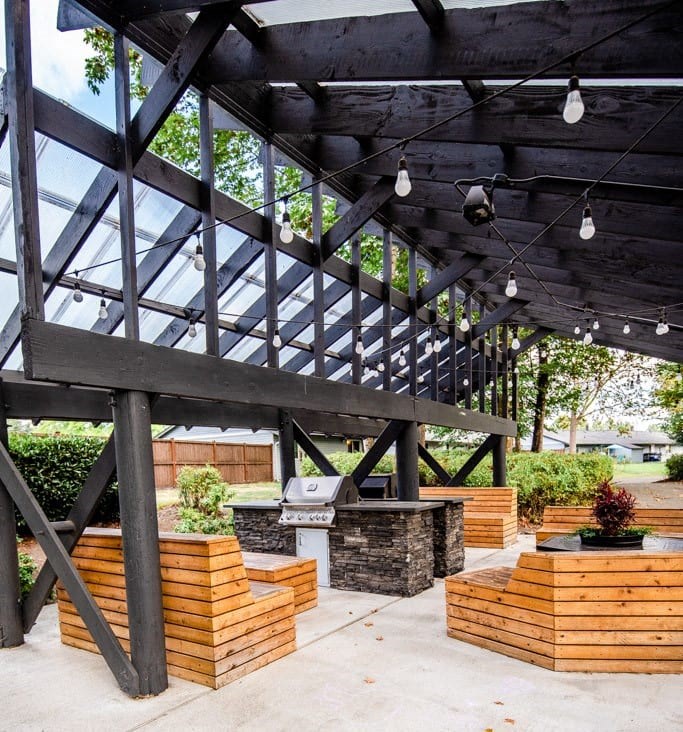 A wooden structure with a glass roof and hanging lights. at The Retreat, Sumner, Washington